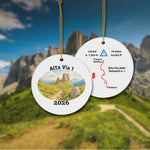 Alta Via 1 personalized trail keepsake ornament hanging with Dolomites background, showing both sides: watercolor landscape front and detailed trail map back.